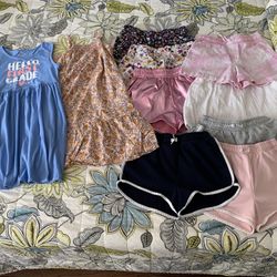 Set of 9 shorts, 2 dresses, and 1 girls size medium t shirt (this only NWT)