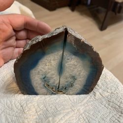 This is a pair of polished blue agate geode bookends, likely made from Brazilian agate and dyed blue. 