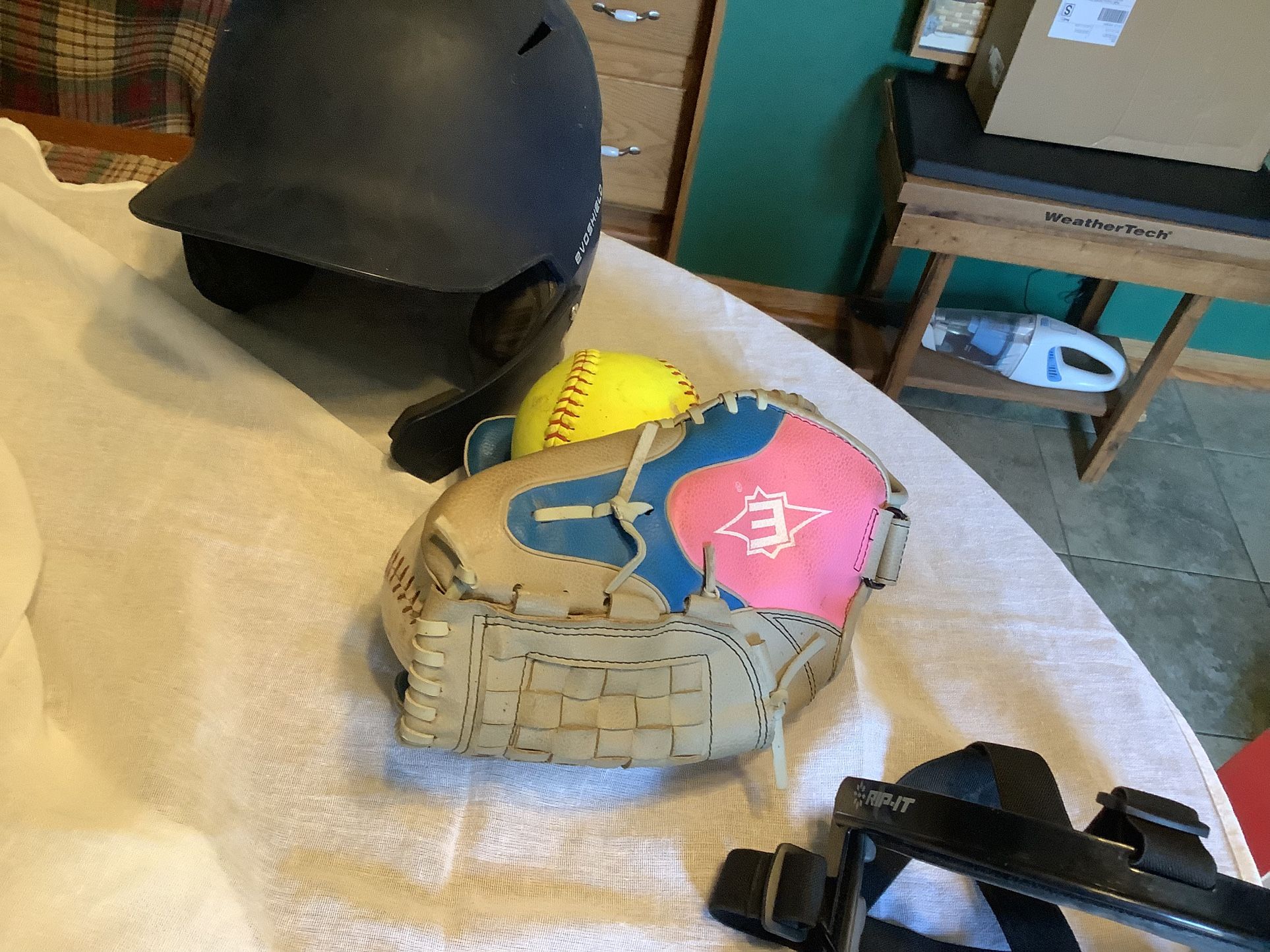 Softball Package including like new Easton 12” softball glove, Rip-it safety mask with adjustable straps Softball helmet Evoshield, size medium 2 sof