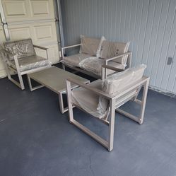 Outdoor patio loveseat with 2 chairs and coffee table