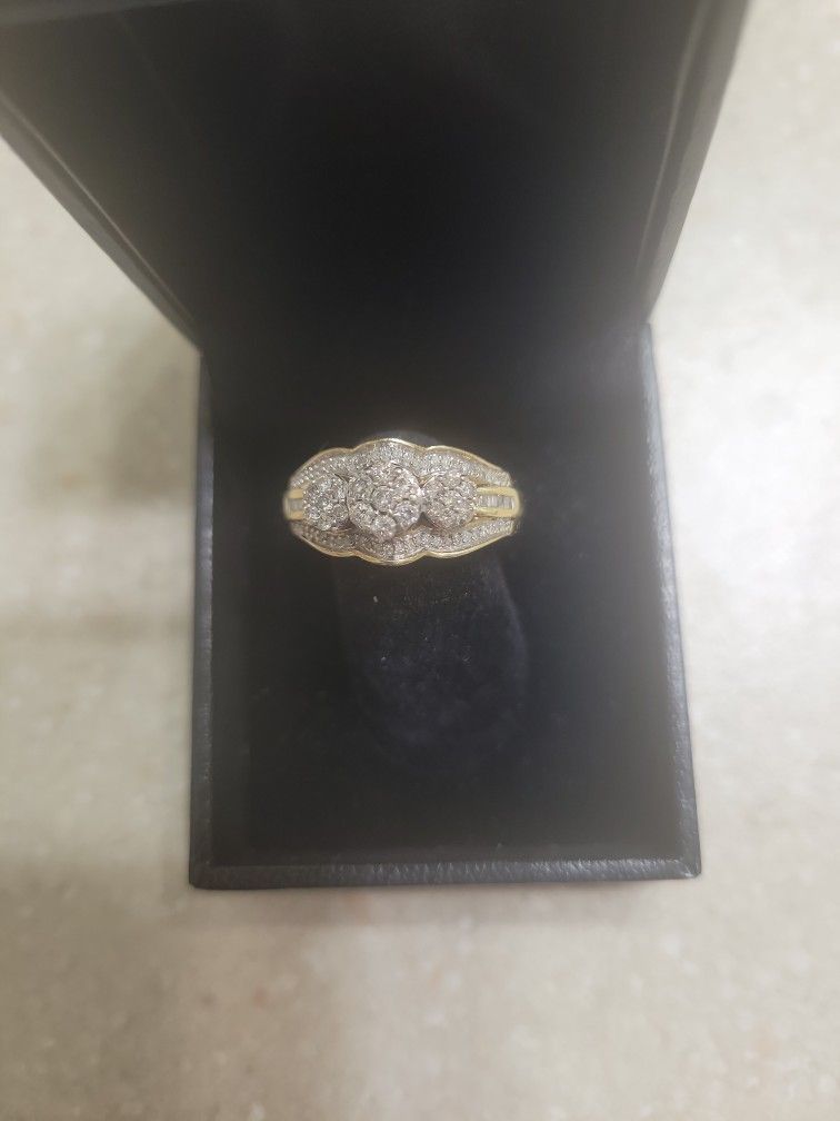 10 K Gold Diamond Ring.  Weight Is 3.4 Grams 