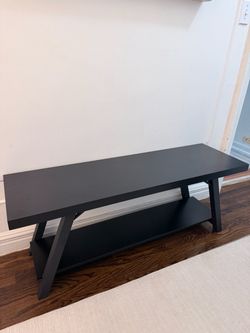 Black bench with lower shelf