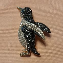 penguin-shaped brooch black and white stones.