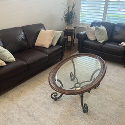 Natuzzi Italsofa 3-Seat Sofa & Love Seat upholstered in chocolate leather with natural wood legs.