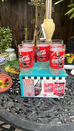 Five Coca Cola Classic glasses