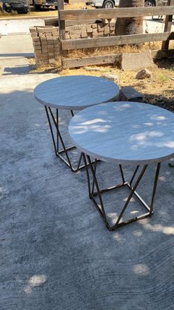 Two round end tables