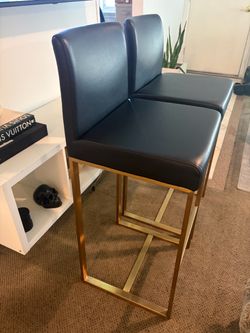 2 modern black and gold barstools