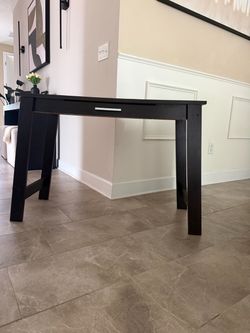 Dark brown console table with drawer