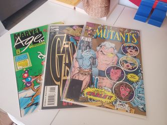 Two used long comic book boxes and 100 comic books / magazines