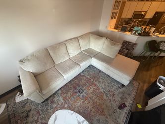 Cream Couch. Light Damage.