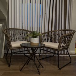 Two outdoor chairs and small table