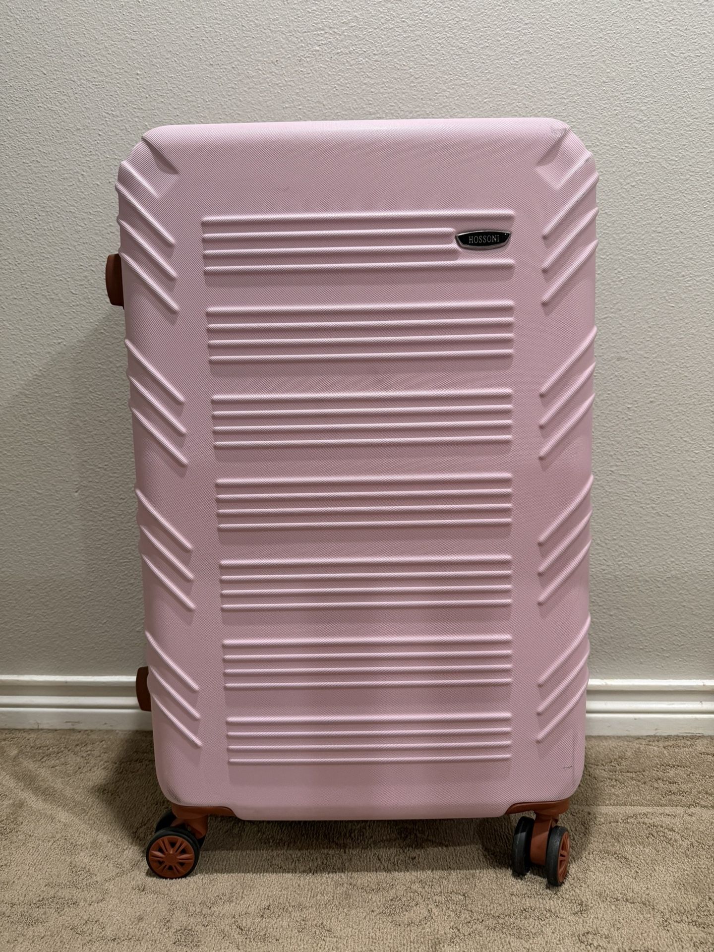 A Pink hard shell luggage 30-inch