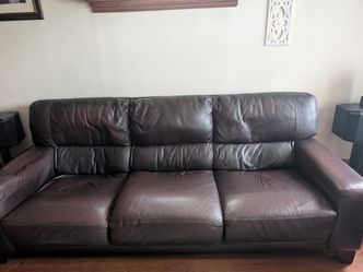 Brown leather couch. 3 cushions  one end is more worn