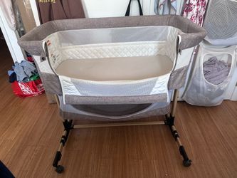 Beige Bassinet w/ bottom storage