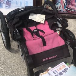 Pink jogger, stroller, three wheels