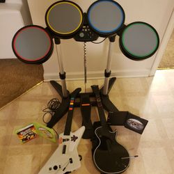 Xbox 360 Rock Band Bundle: Wired Drum Set, 2x Guitar Hero Guitars, Game Lot. You will get everything you see.

One drum set with the pedal.
Two Guitar