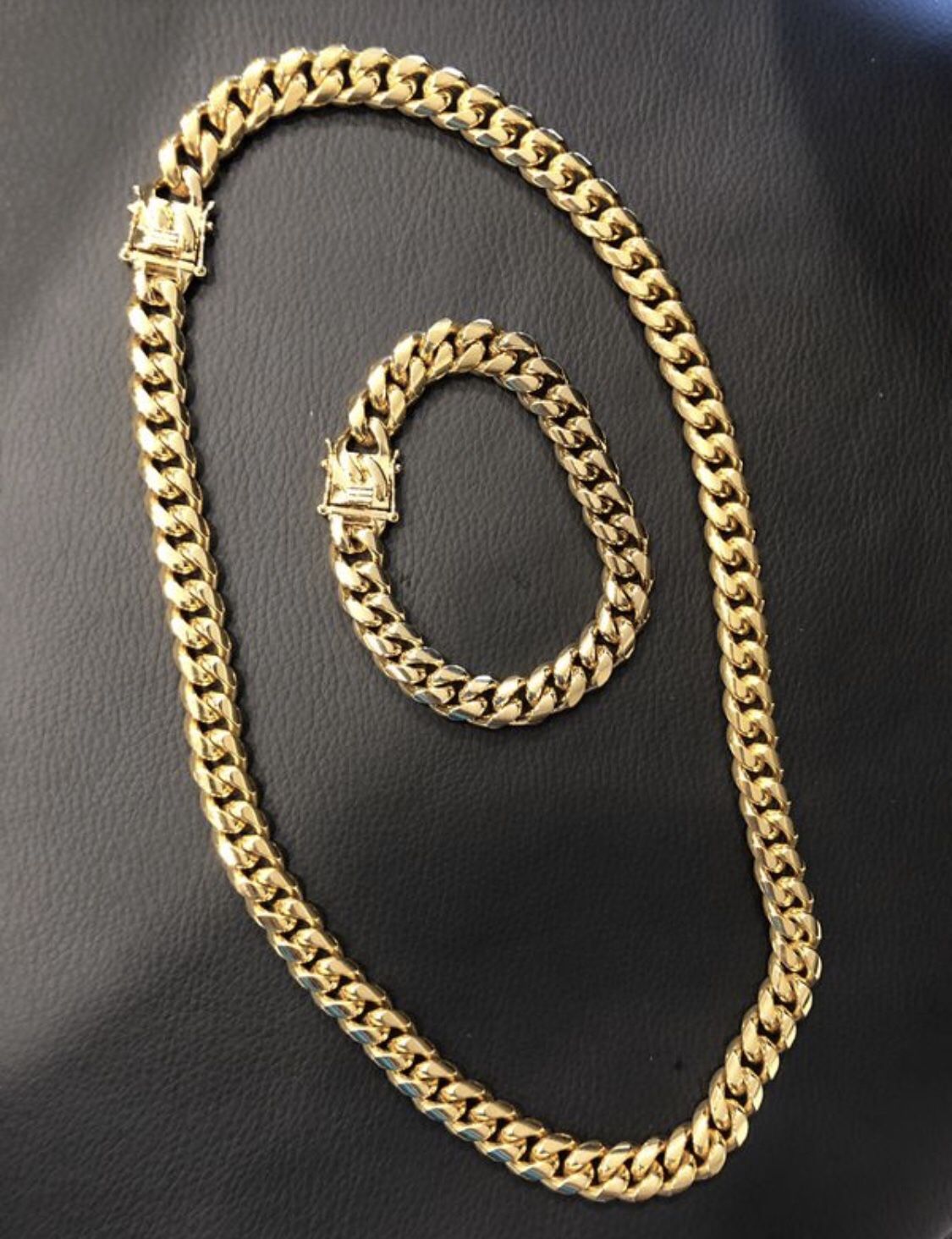 New 14 k yellow gold Cuban link chain and bracelet
