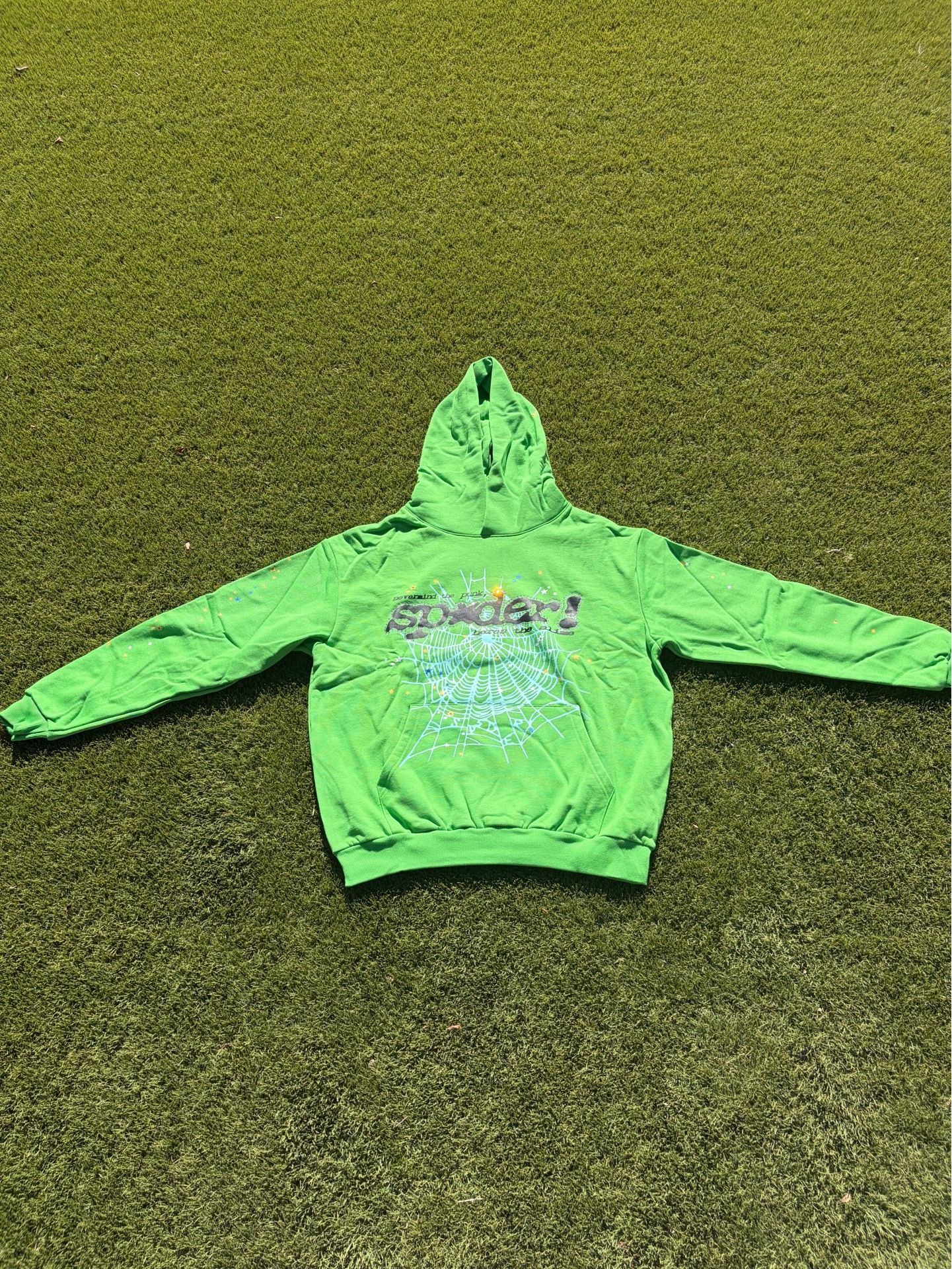 That lime green hoodie is so vibrant and eye-catching! The spiderweb design is really cool, gives it a unique vibe. Are you thinking of wearing it out