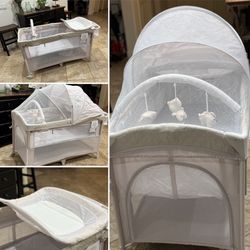 4-in-1 baby bassinet, bedside sleeper, crib, and changing table.  (Queen Creek)