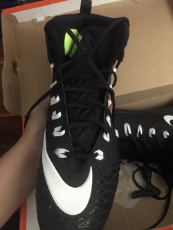 Football cleats and chin guard