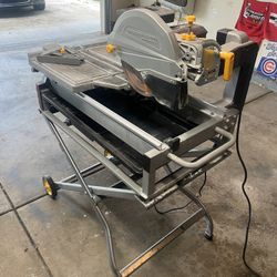 Chicago electric 10” 2.5 hp tile brick saw w/ stand  two position, cutting head built-in 3 gallon per minute water pump Removable, easy to clean high 