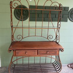 A real nice metal piece looks like a large plant stand could go out on the patio