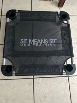 DOG ELEVATED COT  “SIT MEANS SIT” 22in x 22in x 5.25in H IN GREAT CONDITION