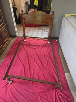 Twin size metal rails and wooden headboard, rails are missing one wheel