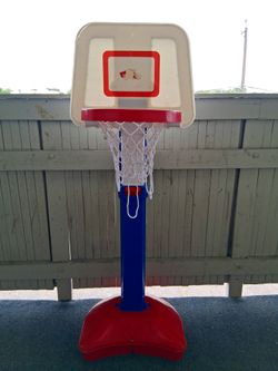 Basketball hoop (plastic, adjustable height.. puppy not included)