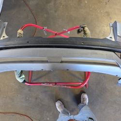 Rear bumper cover assembly for a Hyundai Tucson NX4.