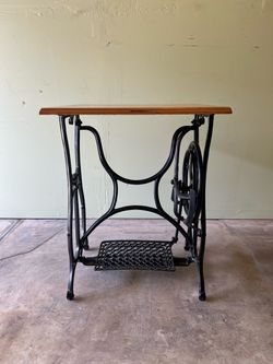 Vintage Sewing Machine Table with castor wheels.