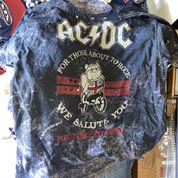 AC/DC graphic t-shirt commemorates the band's 1982 British Tour for their landmark album, For Those About to Rock We Salute You.   The shirt features 