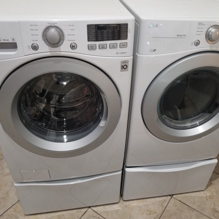 LG Large Capacity Stackable Washer And Gas Dryer On Pedestals