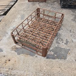 vintage metal Coca-Cola crate designed to hold 24 glass soda bottles
