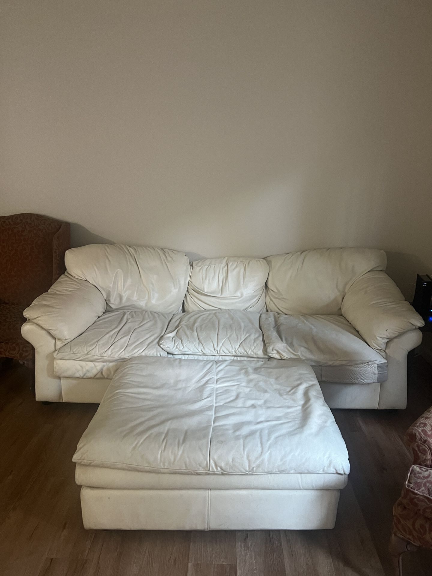 Leather Couch And Ottoman + Two Red Chairs 