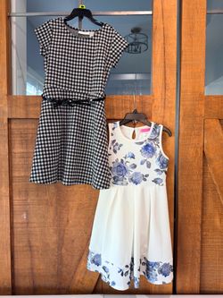 2 dresses (Black Checkered with Belt & White with Blue Flowers) Size 6x