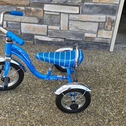 Schwinn tricycle with blue stripe seat