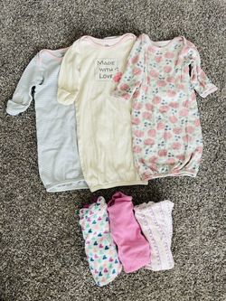 Baby girl sleep gowns and swaddles.