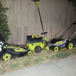 2 lawnmowers a weed wacker and vacuum set