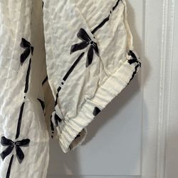 New without tag size, large cream shirt with black bow print