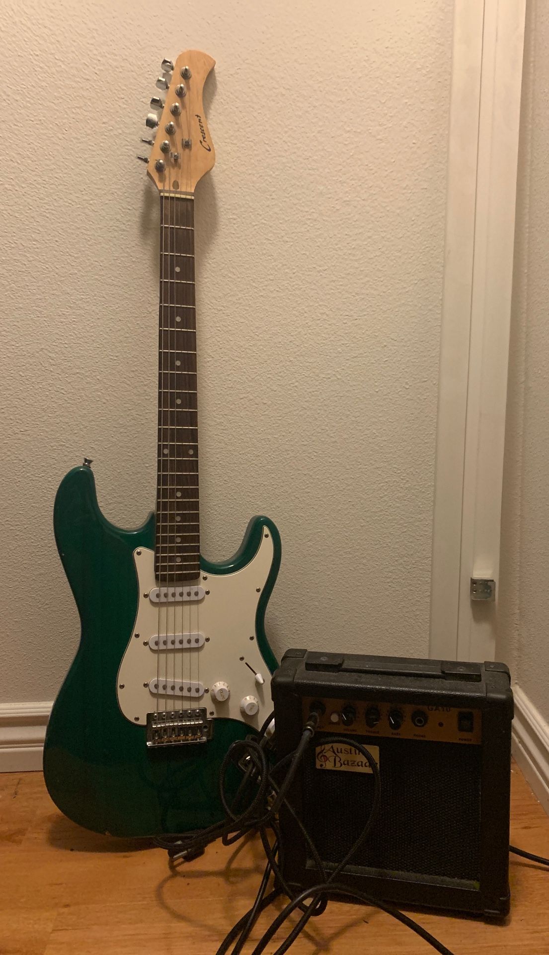 Electric Guitar (with amp and unopened strings)