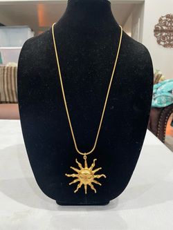 Anne Klein vintage gold-tone sun face pendant necklace.