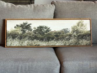 Canvas artwork framed in wood