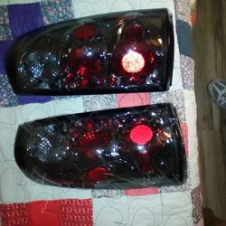 BRAND NEW AFTERMARKET TAIL LIGHTS FOR 99-06 CHEVY GMC
