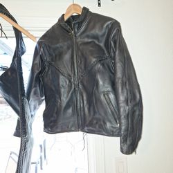 Leather Set Up For A Female Jacket , Chaps , And Vests And One Man's Harley Davidson Jacket All Brand New Only Worn Twice