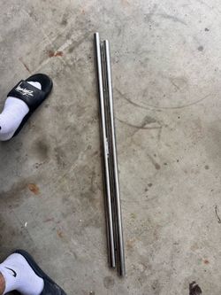 Two stainless steel tubes. Three feet tall each