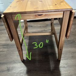 Wood table for 2 people. Extendable and foldable as seen on pictures! Comes with 2 sturdy chairs