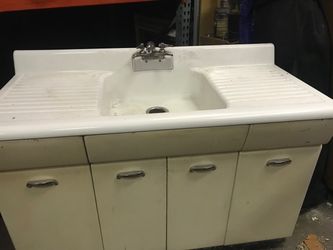 Old steel sink base cabinet