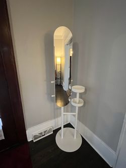Practical home entrance mirror with shelves