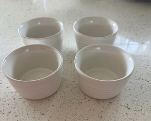 Set of 4 authentic Le Creuset stoneware ramekins in classic white.